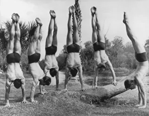 <b class=qtipBold><figcaption>Swedish Gymnasts</figcaption></b><br>Swedish gymnasts perform handstands by a brook, circa 1930. (Photo by FPG/Hulton Archive/Getty Images)<br><em>© 2004 Getty Images</em> Swedish Gymnasts