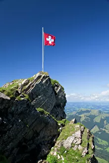 Shooting Gallery: Swiss flag on a mountain in the Alpstein Range, Appenzell, Switzerland, Alps, Europe