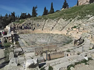<b class=qtipBold><figcaption>Theatre of Dionysus, Athens, Greece</figcaption></b><br>View of the Theatre of Dionysus Eleuthereus at the foot of the ancient Acropolis in Athens, Greece. Group of tourists (tiny figures) walking and sitting on the steps.<br><em>© Federica Grassi</em> Theatre of Dionysus, Athens, Greece