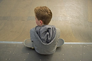 Thirteen-year-old boy with skateboard, Germany Thirteen-year-old boy with skateboard, Germany