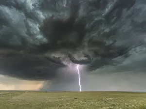 <b class=qtipBold><figcaption>ThunderBolt over Colorado. USA</figcaption></b><br>Extreme weather with forked lightning. This stunning supercell storm over the vast plains of Colorado, produced thousands of lightning bolts and several funnel clouds with powerful straight-line winds, dramatic to watch and difficult to photograph at times.<br><em>© John Finney Photography</em> ThunderBolt over Colorado. USA