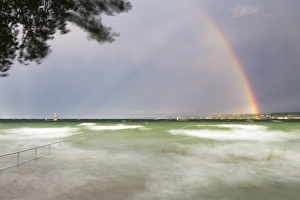 Thunderstorm and high waves at the Horn outdoor pool, rainbow over Lake Constance Thunderstorm and high waves at the Horn outdoor pool, rainbow over Lake Constance