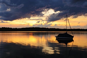Thunderstorm at sunset on near the Seeburg on Lake Starnberg, Allmannshausen, Bavaria, Germany, Europe Thunderstorm at sunset on near the Seeburg on Lake Starnberg, Allmannshausen, Bavaria, Germany, Europe