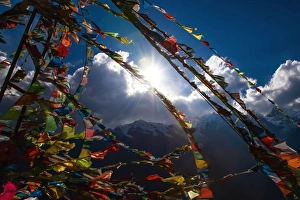 Tibetan prayer flags and snow mountain in China Tibetan prayer flags and snow mountain in China