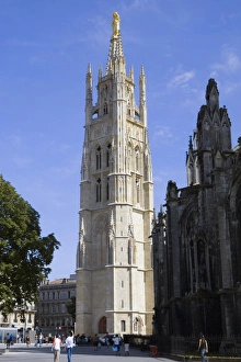 Tourists at a church, St. Andre Cathedral, Tour Pey Berland, Bordeaux, Aquitaine, France Tourists at a church, St. Andre Cathedral, Tour Pey Berland, Bordeaux, Aquitaine, France
