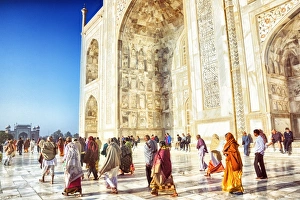 <b class=qtipBold><figcaption>Tourists at the Taj Mahal</figcaption></b><br>Tourists visit the Taj Mahal in Agra, India.<br><em>© powerofforever</em> Tourists at the Taj Mahal