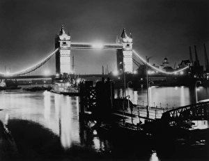 <b class=qtipBold><figcaption>Tower Bridge</figcaption></b><br>A floodlit Tower Bridge on the River Thames, London, 13th July 1953. (Photo by Fresco/Topical Press Agency/Hulton Archive/Getty Images)<br><em>© 2007 Getty Images</em> Tower Bridge