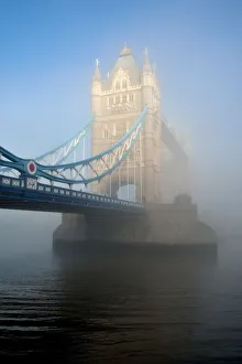<b class=qtipBold><figcaption>Tower Bridge Glows in the Fog</figcaption></b><br>The morning sun burns through the London fog, illuminating Tower Bridge across the Thames.<br><em>© © 2013. Adam Lister</em> Tower Bridge Glows in the Fog