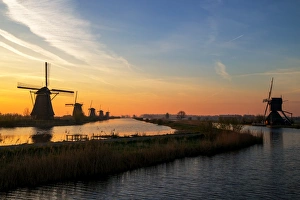 Traditional windmills at sunrise, Kinderdijk Traditional windmills at sunrise, Kinderdijk