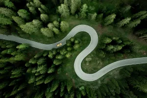 Prints of Overhead view of car driving on s-shape mountain road, Giau Pass, Dolomites, Veneto, Italy Travel Imagery Prints: Aerial View of Car on Winding Mountain Road Print