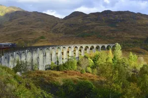 Prints of Sir Robert McAlpine built Glenfinnan Viaduct in concrete and it was completed in 1898. It is on the West Highland line railway line between Fort William and Mallaig Travel Imagery Prints: Glenfinnan Viaduct Print, West Highland Line
