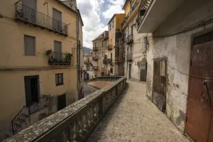 Prints of A footpath in Corigliano Calabro, southern Italy. You walk up against houses and under balconies Travel Imagery Prints: Pathway in Corigliano Calabro Print, Southern Italy