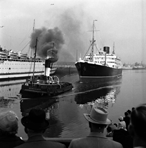 Tugboat At Work; hauling a liner into one of the dockyards on Clydeside Tugboat At Work; hauling a liner into one of the dockyards on Clydeside