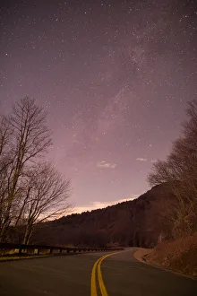 <b class=qtipBold><figcaption>Twisted Journey</figcaption></b><br>The milky way rising above the Blue Ridge Parkway located in Blowing Rock, NC.<br><em>© ROBERT LOE</em> Twisted Journey