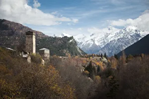 Typical Svanetian Tower and the High Caucasus mountains in Mestia, Svaneti, Georgia Typical Svanetian Tower and the High Caucasus mountains in Mestia, Svaneti, Georgia