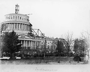<b class=qtipBold><figcaption>United States Capitol Building</figcaption></b><br>View of the United States Capitol Building, showing the dome under construction, on Pennsylvania Avenue, Washington DC, USA, pictured on the day of the inauguration of President Abraham Lincoln, 4 March 1861. (Photo by Fotosearch/Getty Images).<br><em>© 2010 Getty Images</em> United States Capitol Building