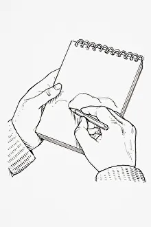 Using pencil held in right hand to sketch rock sample on notepad Using pencil held in right hand to sketch rock sample on notepad