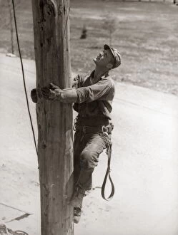 Images Dated 18th October 2005: Utility Worker Man Is Climbing Electric Power Utilities Pole