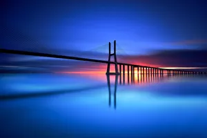 <b class=qtipBold><figcaption>Vasco da Gama</figcaption></b><br>The Ponte Vasco da Gama Lisbon is a massive 17km long bridge that spans the shallow but wide Tagus Estuary to the east of Lisbon. This massive bridge was once Europe longest bridge and was named after Portugal great explorer Vasco da Gama.<br><em>© fredconcha</em> Vasco da Gama