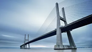 <b class=qtipBold><figcaption>Vasco da Gama Bridge</figcaption></b><br>The Ponte Vasco da Gama Lisbon is a massive 17km long bridge that spans the shallow but wide Tagus Estuary to the east of Lisbon. This massive bridge was once Europe longest bridge and was named after Portugal great explorer Vasco da Gama.<br><em>© FredConcha</em> Vasco da Gama Bridge