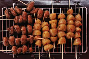 Vegetarian grilling, mushrooms and potato on skewers, Germany Vegetarian grilling, mushrooms and potato on skewers, Germany
