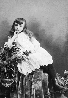 <b class=qtipBold><figcaption>Velvet Seat</figcaption></b><br>circa 1885: A young girl in an embroidered dress reclines on a velvet cloth in a photographer's studio, New York City. (Photo by Hulton Archive/Getty Images) Velvet Seat