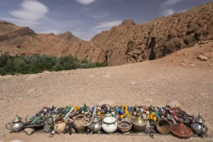 Images Dated 7th May 2013: Vendor displays souvenirs and trinkets on blanket alongside road, Dades Gorge, Morocco