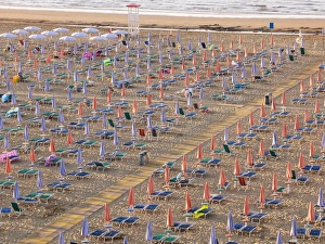 View of the beach in the early morning with closed parasols and sun loungers, Lignano Sabbiadoro, Udine, Adriatic Coast, Italy, Europe View of the beach in the early morning with closed parasols and sun loungers, Lignano Sabbiadoro, Udine, Adriatic Coast, Italy, Europe