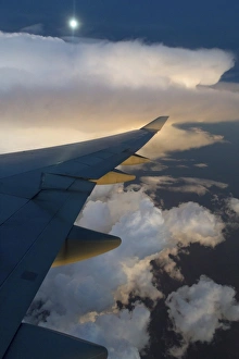 View from a Boeing 747-400 of a storm front at full moon, Australia View from a Boeing 747-400 of a storm front at full moon, Australia