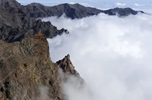 View from the caldera rim over a sea of clouds in the Caldera de Taburiente National Park View from the caldera rim over a sea of clouds in the Caldera de Taburiente National Park