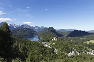 View from Jugend lookout point over Lake Alpsee and Schloss Hohenschwangau Castle towards View from Jugend lookout point over Lake Alpsee and Schloss Hohenschwangau Castle towards