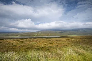 View over the moor with Loch Coulside and Ben Loyal in the clouds, Sutherland, Scotland View over the moor with Loch Coulside and Ben Loyal in the clouds, Sutherland, Scotland