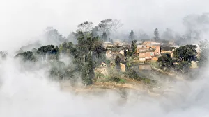 <b class=qtipBold><figcaption>A Village in the fog</figcaption></b><br>A Chinese village shrouded by the fog.<br><em>© Xiaoyu Yu</em> A Village in the fog