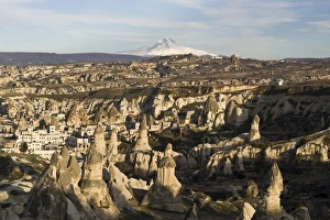 The village of Goreme in front of the snow-capped volcano Erciyes Dagi, Cappadocia, Turkey The village of Goreme in front of the snow-capped volcano Erciyes Dagi, Cappadocia, Turkey