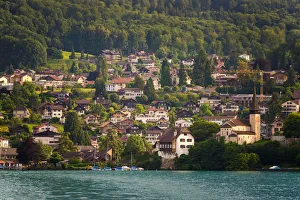 The village and landscape beside lake Thun, Switzer The village and landscape beside lake Thun, Switzer