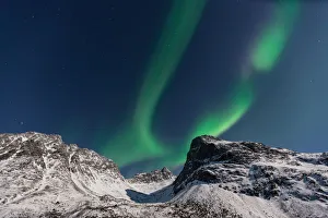 <b class=qtipBold><figcaption>Violin Landscape</figcaption></b><br>Northern Lights (Aurora Borealis) over GrotfjAžrd, KvalAžya (lit. Whale Island).KvalAžya is a montainous island located in Troms county in northern Norway.Moonlit, snowcapped mountains.<br><em>© 2015 Krzysztof Baranowski</em> Violin Landscape
