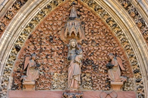 The Virgin Mary with angels in the tympanum of the portal of the Gothic St. Elizabeths Church, Marburg, Hesse, Germany The Virgin Mary with angels in the tympanum of the portal of the Gothic St. Elizabeths Church, Marburg, Hesse, Germany