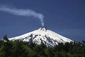 Volcanic smoke rising from Villarrica or Rucapillan Volcano, seen from Pucon, Chile Volcanic smoke rising from Villarrica or Rucapillan Volcano, seen from Pucon, Chile