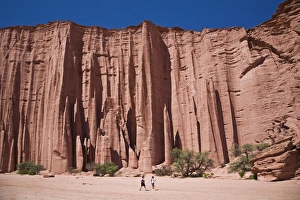 Walker in the Sandstone canyon in the national park, Parque Nacional Talampaya, Argentina Walker in the Sandstone canyon in the national park, Parque Nacional Talampaya, Argentina