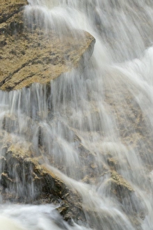 Water cascade, water flowing over rocks in the stream bed of the Ilse River, Ilsenburg Water cascade, water flowing over rocks in the stream bed of the Ilse River, Ilsenburg