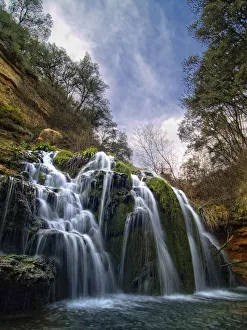 Waterfall called Blue Lake among ravines oaks Waterfall called Blue Lake among ravines oaks