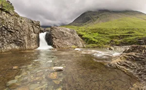 Waterfall in Fairy Pools rocky stream on Isle of Skye - Scotland Waterfall in Fairy Pools rocky stream on Isle of Skye - Scotland