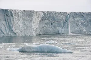 Waterfall of meltwater at the glacier front of Brasvellbreen, the longest glacier front in the northern hemisphere, Austfonna, Nordaustlandet, Svalbard Archipelago, Svalbard and Jan Mayen, Norway Waterfall of meltwater at the glacier front of Brasvellbreen, the longest glacier front in the northern hemisphere, Austfonna, Nordaustlandet, Svalbard Archipelago, Svalbard and Jan Mayen, Norway