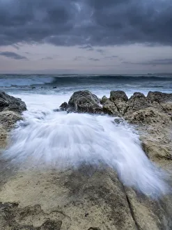 Waves jumping the rocks in the temporary one Waves jumping the rocks in the temporary one