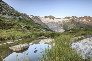 Waxeggkees Glacier, reflection in a small tarn, Zemmgrund valley, Ginzling, Zillertal valley, Tyrol, Austria Waxeggkees Glacier, reflection in a small tarn, Zemmgrund valley, Ginzling, Zillertal valley, Tyrol, Austria