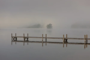 Wharf in the fog on Lake Staffelsee with the island of Woerth near Seehausen, Murnau Wharf in the fog on Lake Staffelsee with the island of Woerth near Seehausen, Murnau