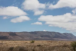 Wide angle shot of dry desert field with clouds, Western Cape Province, South Africa Wide angle shot of dry desert field with clouds, Western Cape Province, South Africa