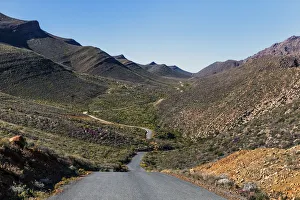 The winding road climbing up the remote and rugged wilderness area of the Cederberg The winding road climbing up the remote and rugged wilderness area of the Cederberg