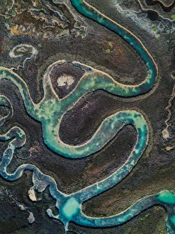 Winding water channel in the marshlands as seen from above, Venetian Lagoon, Italy Winding water channel in the marshlands as seen from above, Venetian Lagoon, Italy