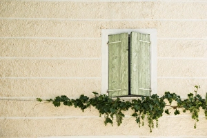 Window almost closed shutters, facade, Buis-les-Baronnies, Drome, Rhone-Alpes, Provence Window almost closed shutters, facade, Buis-les-Baronnies, Drome, Rhone-Alpes, Provence